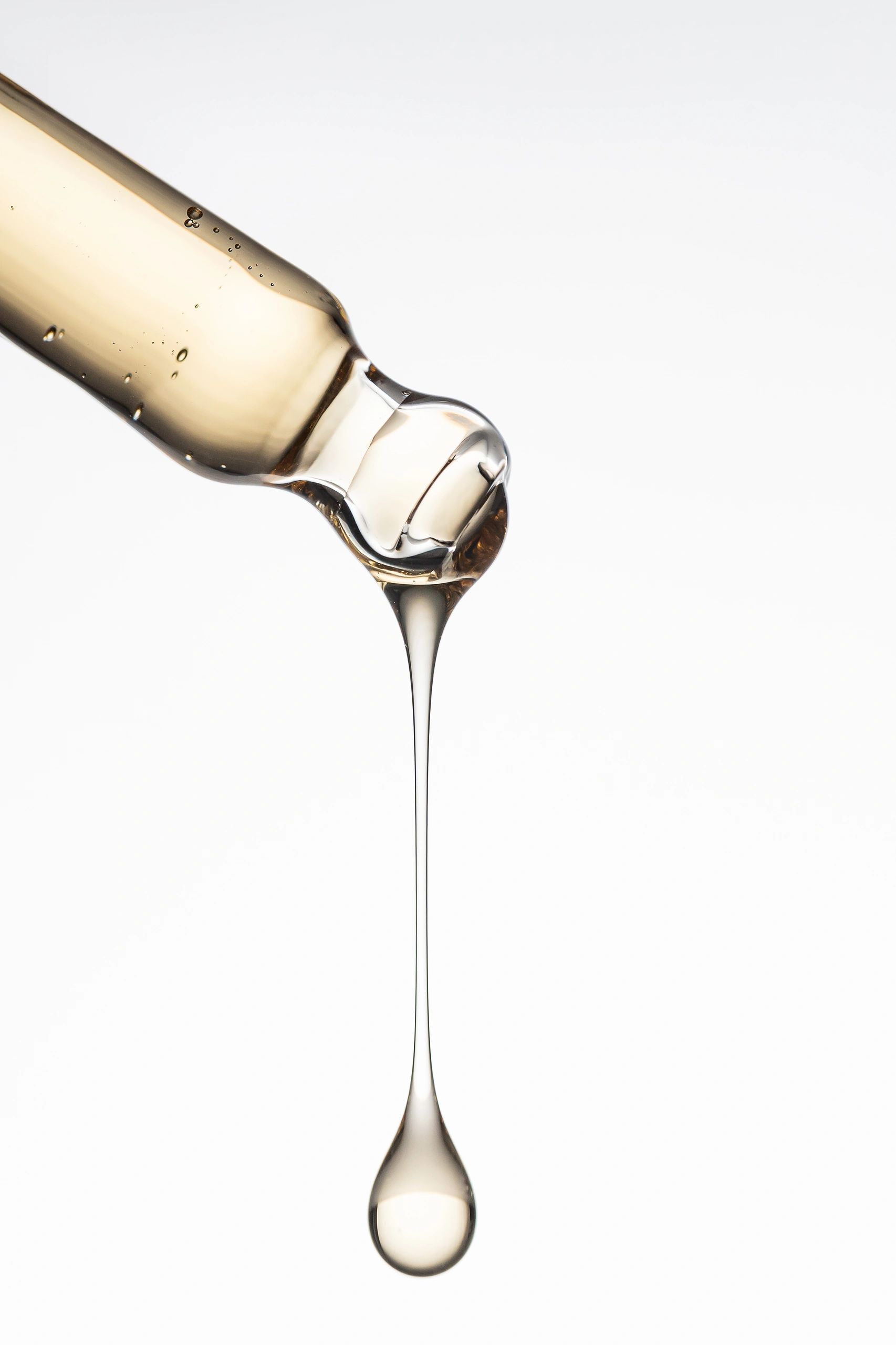 Luxury skincare serum dropper close-up
